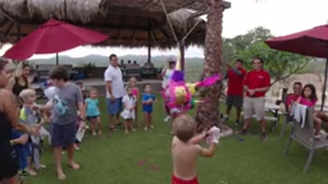 LOS CABOS MEXICO-2019: Children And Adults In Greenery Watch A Child Whack