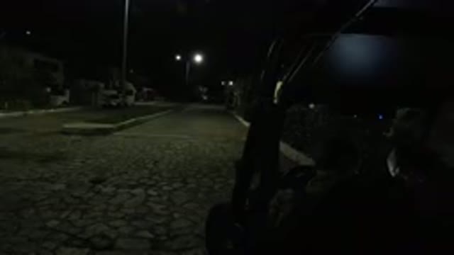 LOS CABOS MEXICO-2019: Night View Of Poorly Lit Cobblestone Street With Movement