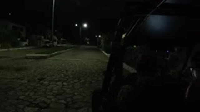 LOS CABOS MEXICO-2019: Industrial Powered Vehicle Parked At Night With People Gathering