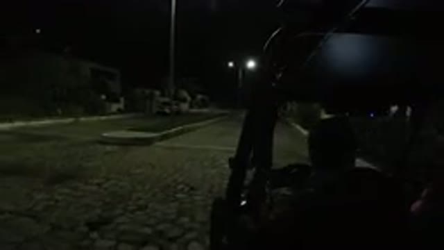 LOS CABOS MEXICO-2019: Vehicle Moves Down City Divided Road At Night Wranglers