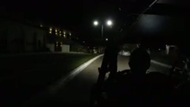 LOS CABOS MEXICO-2019: One Jeep Traveling at Night on a Road with Trees and Houses on Both Sides