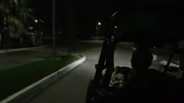 LOS CABOS MEXICO-2019: Two Men Are Driving A Wrangler At Night Through A Residential Street