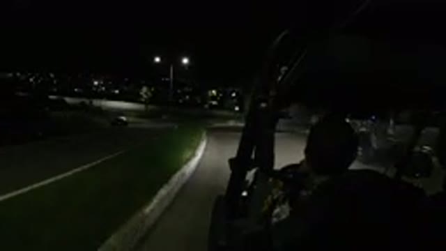 LOS CABOS MEXICO-2019: Man Drives Over Speed Bump While Driving Down Road At Night