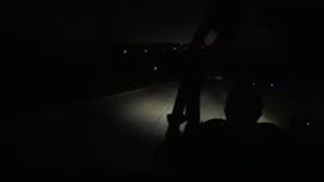 LOS CABOS MEXICO-2019: A Man Drives A Wrangler Down An Unlit Road With Its Dimly
