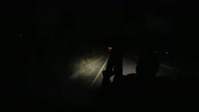 LOS CABOS MEXICO-2019: Jeep Driving On A Road In The Dark With Only A Small Light