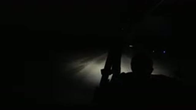 LOS CABOS MEXICO-2019: Man With Glasses Driving Jeep Down Road In The Pitch Dark