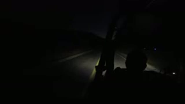 LOS CABOS MEXICO-2019: A Guy Driving Down The Road In A Go Cart At Night In The
