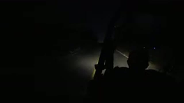 LOS CABOS MEXICO-2019: Man Driving A Humvee At Night Snapping His Fingers