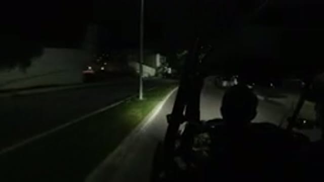 LOS CABOS MEXICO-2019: Camera Mounted On The Side Of A Jeep Driving Down A Dark