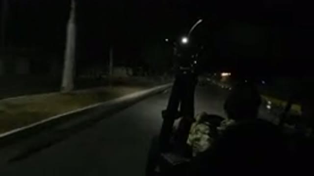 LOS CABOS MEXICO-2019: Man Driving Wrangler At Night In The City With Palm Trees