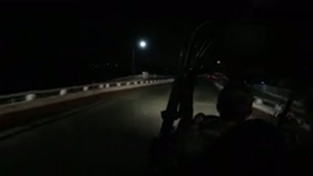 LOS CABOS MEXICO-2019: Man Goes On A Night Time Drive Along An Empty Road