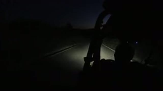 LOS CABOS MEXICO-2019: Vehicle Moves Down Paved Road At Night Hint Of Orange