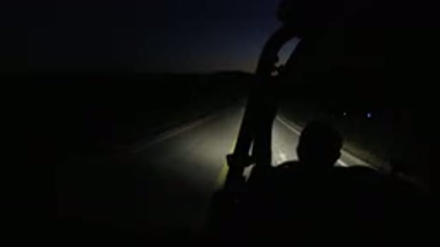 LOS CABOS MEXICO-2019: Vehicle Moves Down Road At Night Begins To Pull Off Road