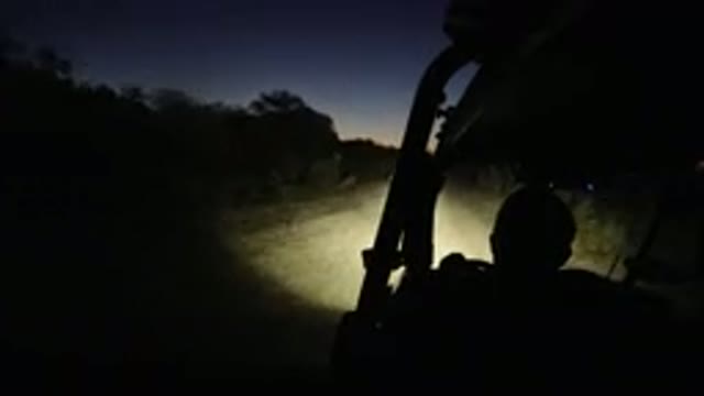 LOS CABOS MEXICO-2019: Vehicle Moves Along Dirt Path At Night Hint Of Orange