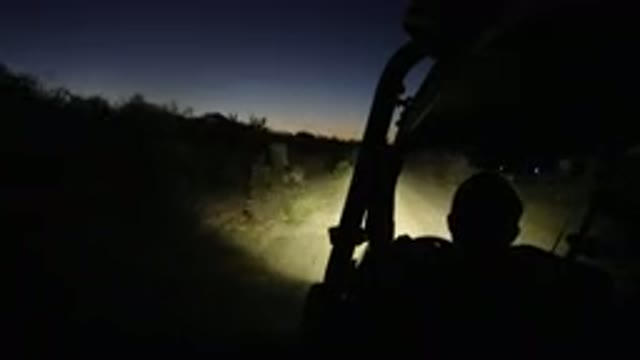 LOS CABOS MEXICO-2019: Jeep Traveling On Dark Sandy Road Through Grass And Trees