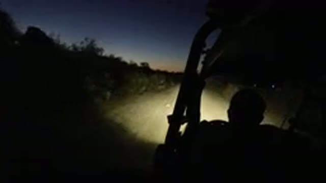 LOS CABOS MEXICO-2019: A Jeep Riding Down The Countryside Late At Night With The