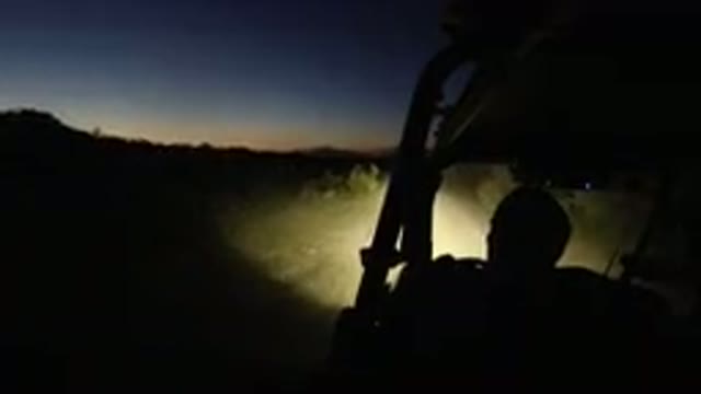 LOS CABOS MEXICO-2019: Man Driving Dune Buggy At Sundown On Dirt Path