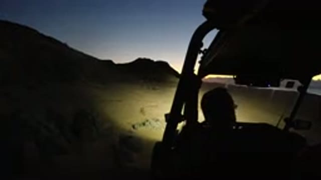 LOS CABOS MEXICO-2019: Midnight Men Driving Convertible Along Beach Sands