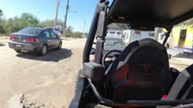 LOS CABOS MEXICO-2019: Wrangler Passes Parked Vehicle On Sunny Day