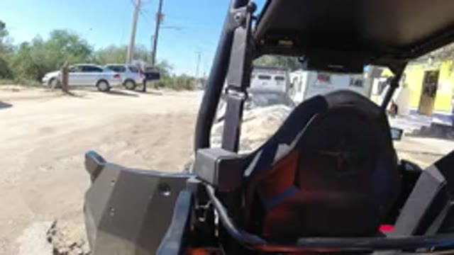 LOS CABOS MEXICO-2019: A Man Is Stopped In A Vehicle On A Dirt Road In Front Of