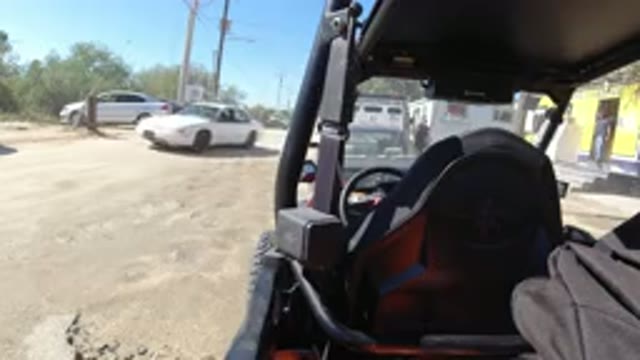 LOS CABOS MEXICO-2019: Vehicle Parked Outside Buildings as People Walk In and Out