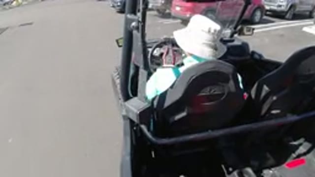 LOS CABOS MEXICO-2019: Person Driving All Terrain Golf Cart In A Parking Lot And