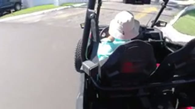 LOS CABOS MEXICO-2019: Man in Hat Drives Unusual Vehicle Down City Street