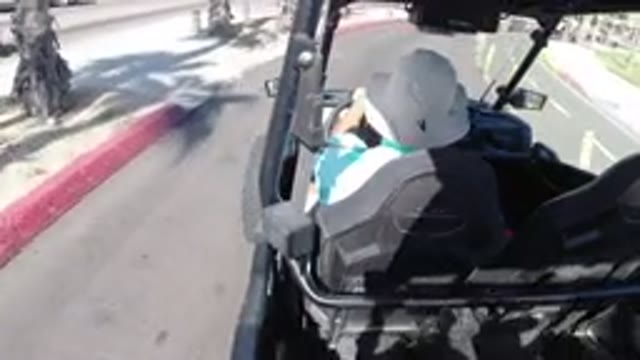 LOS CABOS MEXICO-2019: Driving An Open Vehicle Round A Corner On A Hot Day
