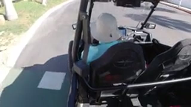 LOS CABOS MEXICO-2019: Person Driving Vehicle Along Urban Path