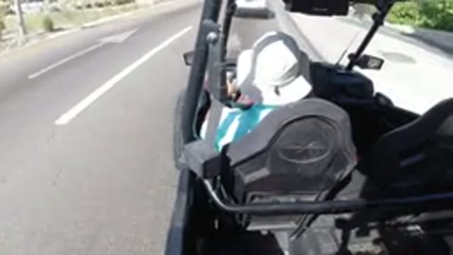 LOS CABOS MEXICO-2019: A Man Driving A Wrangler On A Sunlit Road