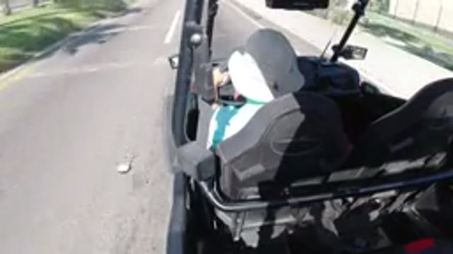 LOS CABOS MEXICO-2019: Man Wearing A Hat Driving A Jeep On A Paved Road With