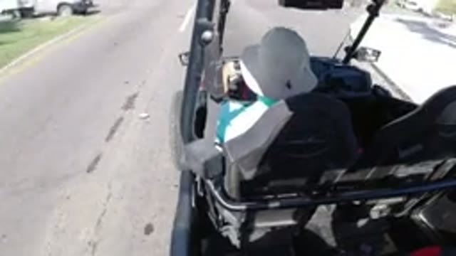 LOS CABOS MEXICO-2019: Person With White Hat Riding Buggy Through Town