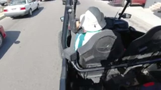 LOS CABOS MEXICO-2019: Black Jeep Driving On The Road With Person Wearing White Hat