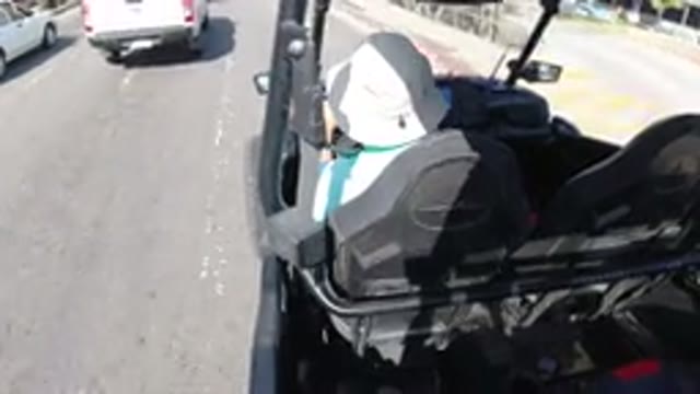 LOS CABOS MEXICO-2019: A Person Drives A Vehicle Alongside Traffic On A Busy