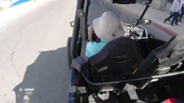 LOS CABOS MEXICO-2019: Golf-Wrangler Driving Fast Down The Street And