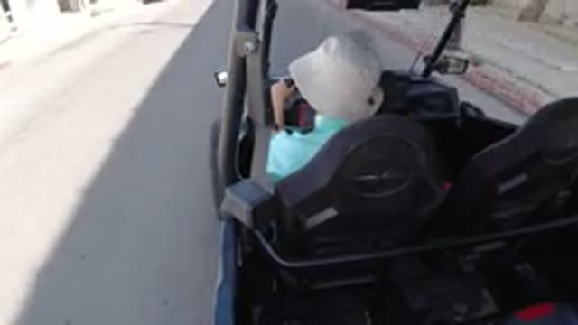 LOS CABOS MEXICO-2019: Guy Wearing A White Hat In A Black Golf Cart Stuck In Traffic