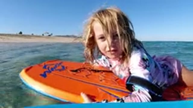 LOS CABOS MEXICO-2019: One Girl Sea Skating Board Playing In The Water And