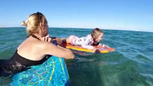 LOS CABOS MEXICO-2019: Mom And Daughter Relaxing In The Ocean