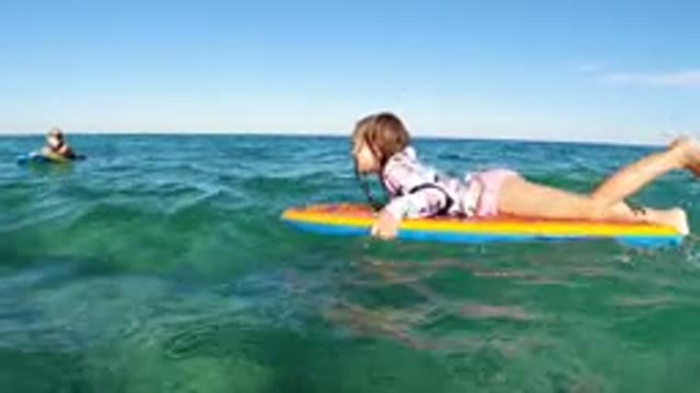 LOS CABOS MEXICO-2019: Children Playing In The Water With Boogie Board During