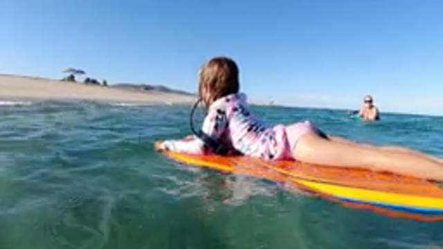 LOS CABOS MEXICO-2019: A Girl Diving Into the Ocean at the Beach