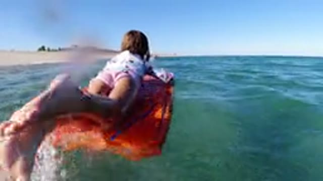 LOS CABOS MEXICO-2019: Little Girl Playing On A Floating Raft On A Large Body Of Water