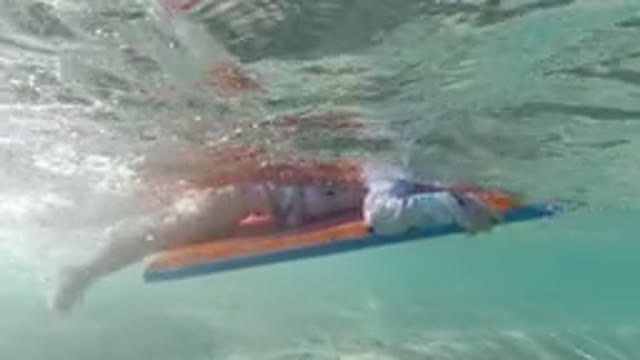 LOS CABOS MEXICO-2019: Little Girl Trying To Learn How To Swim By Practicing In