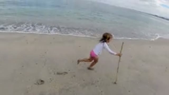 LOS CABOS MEXICO-2019: A Little Girl Running Along A Beach On Vacation