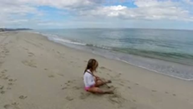 LOS CABOS MEXICO-2019: Little Blonde Girl Having Fun On The Beach Playing In The