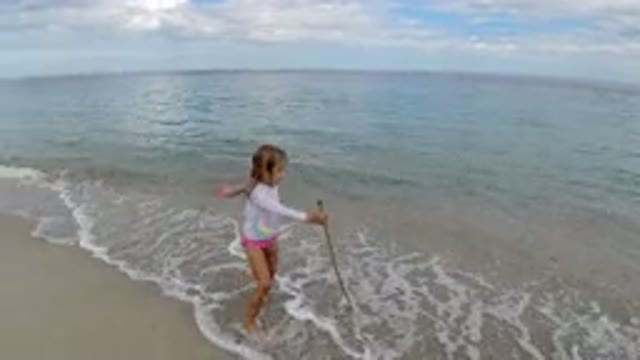 LOS CABOS MEXICO-2019: Child Playing On The Beach Happy Sunny Day With Wood In