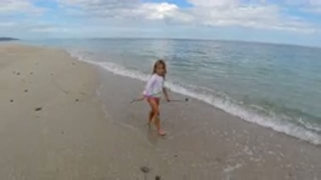 LOS CABOS MEXICO-2019: Young Child Playing With A Stick On The Sand At The Beach