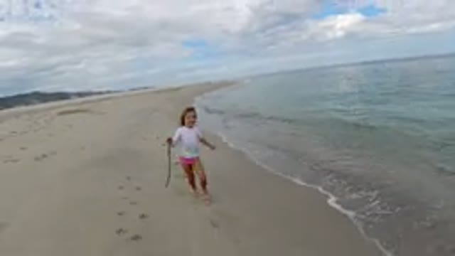 LOS CABOS MEXICO-2019: A Small Girl Enjoying the Beach with a Stick