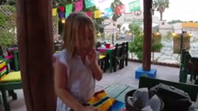 LOS CABOS MEXICO-2019: Child Eating at Table During Party