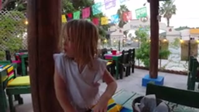 LOS CABOS MEXICO-2019: Young Blond Girl At A Mexican-Themed Party On A Covered Deck