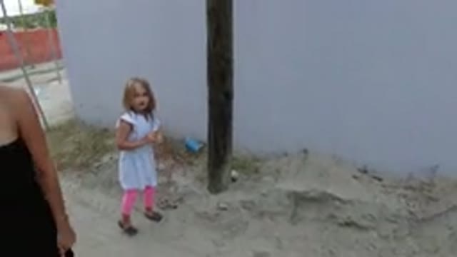 LOS CABOS MEXICO-2019: Little Girl Playing Around The Street Even Though Her